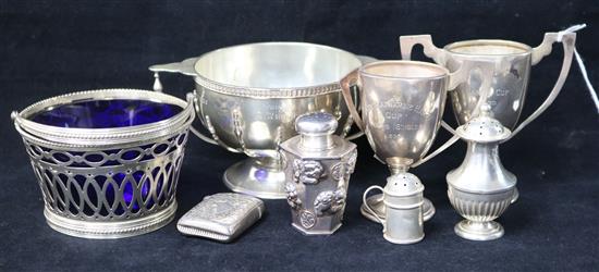 Three small silver trophy cups, a Dutch silver sugar basket and four other items including a Chinese silver pepperette.